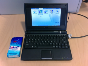 Asus Eee PC 700 (black model), compared with tissues and Kensington lock